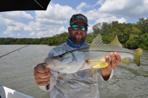 Capt. Jason of Chasing Tails Charters Catching snook on his day off